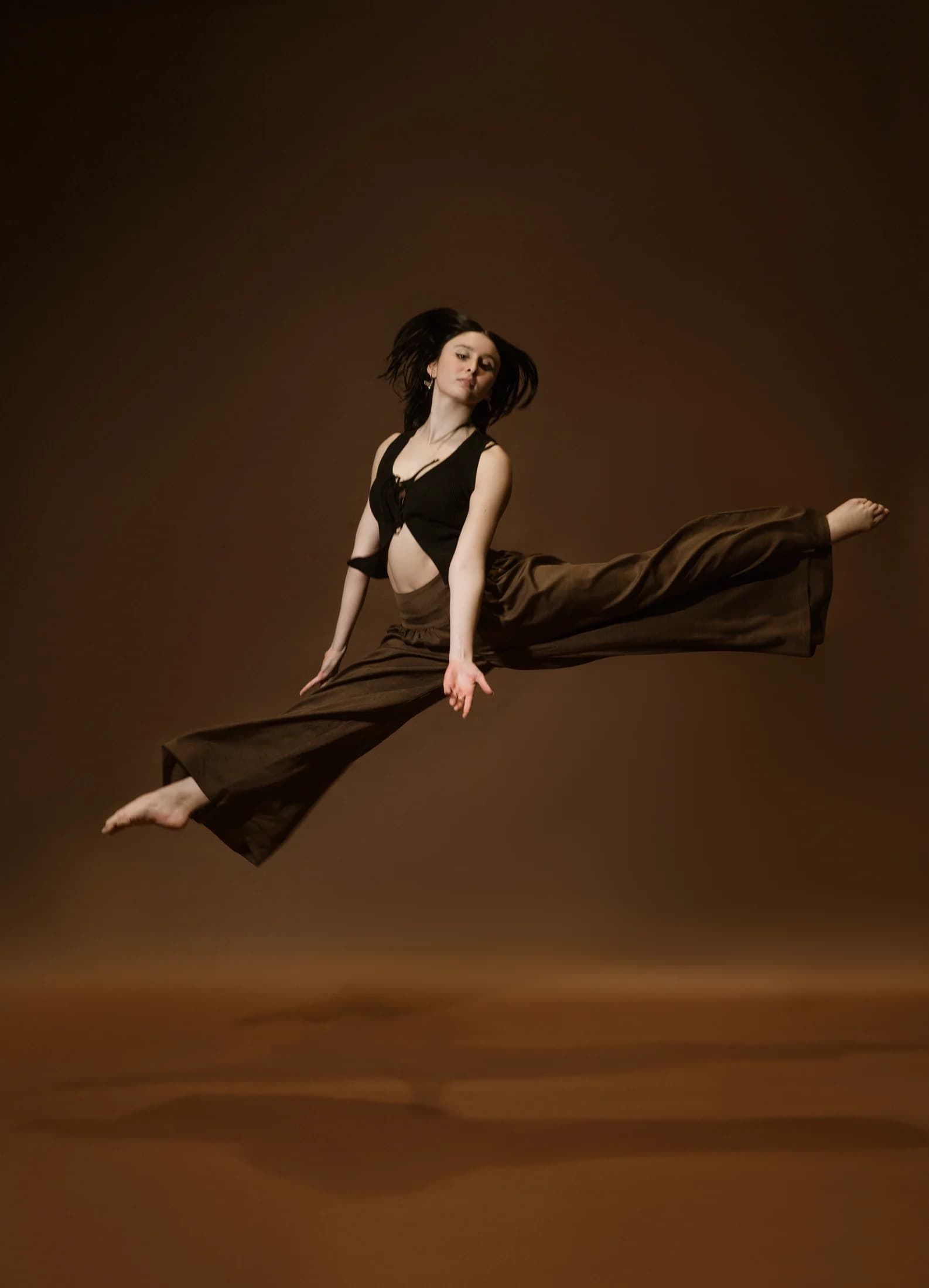 Estafania Forero Yacaman suspended in a studio leap