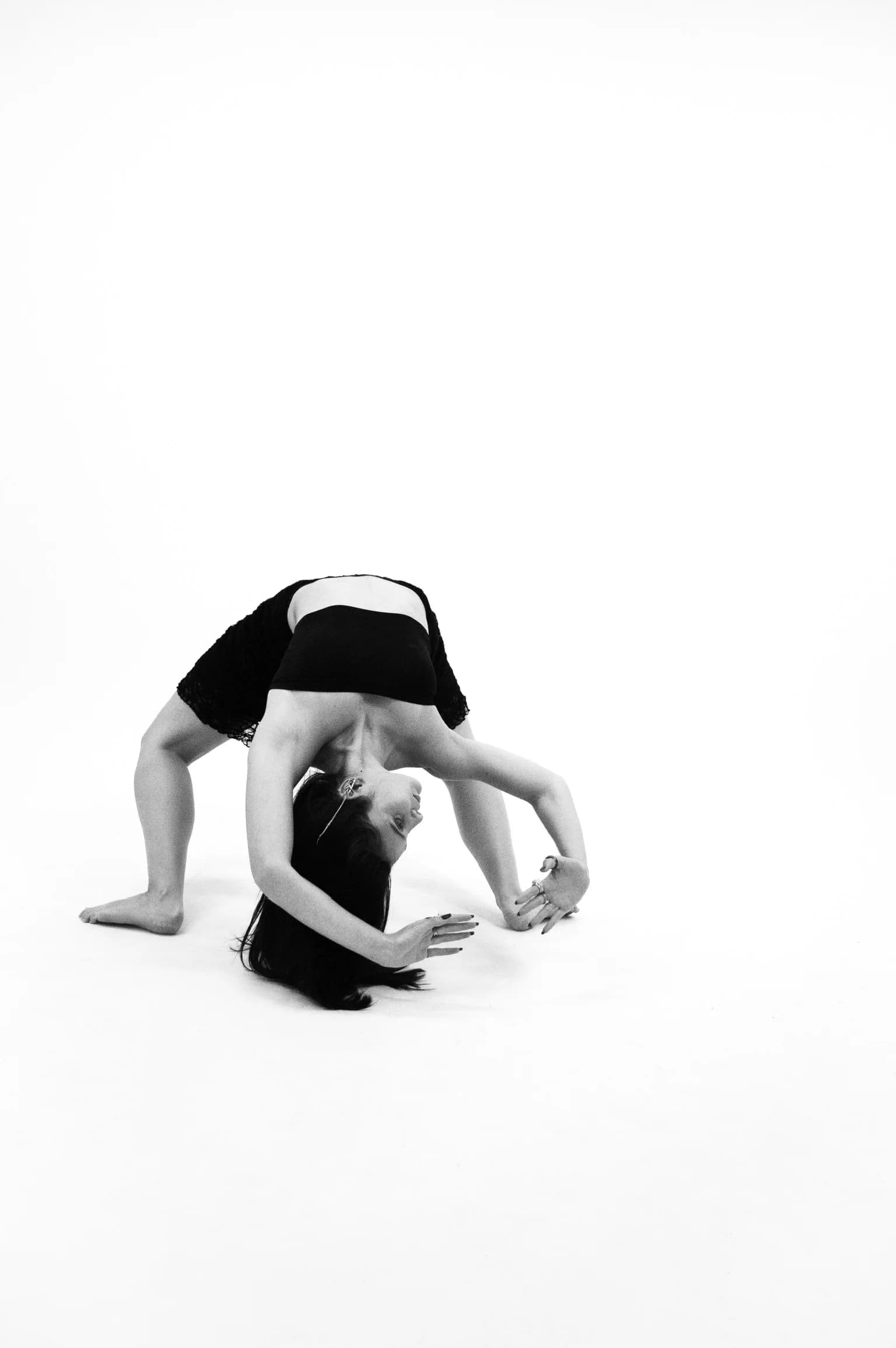 Estefanía Forero Yacamán in a black-and-white backbend portrait