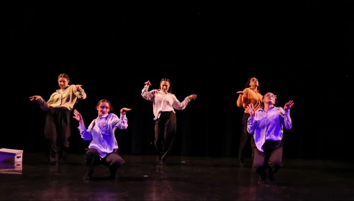 Agua Ardiente company spread across the stage