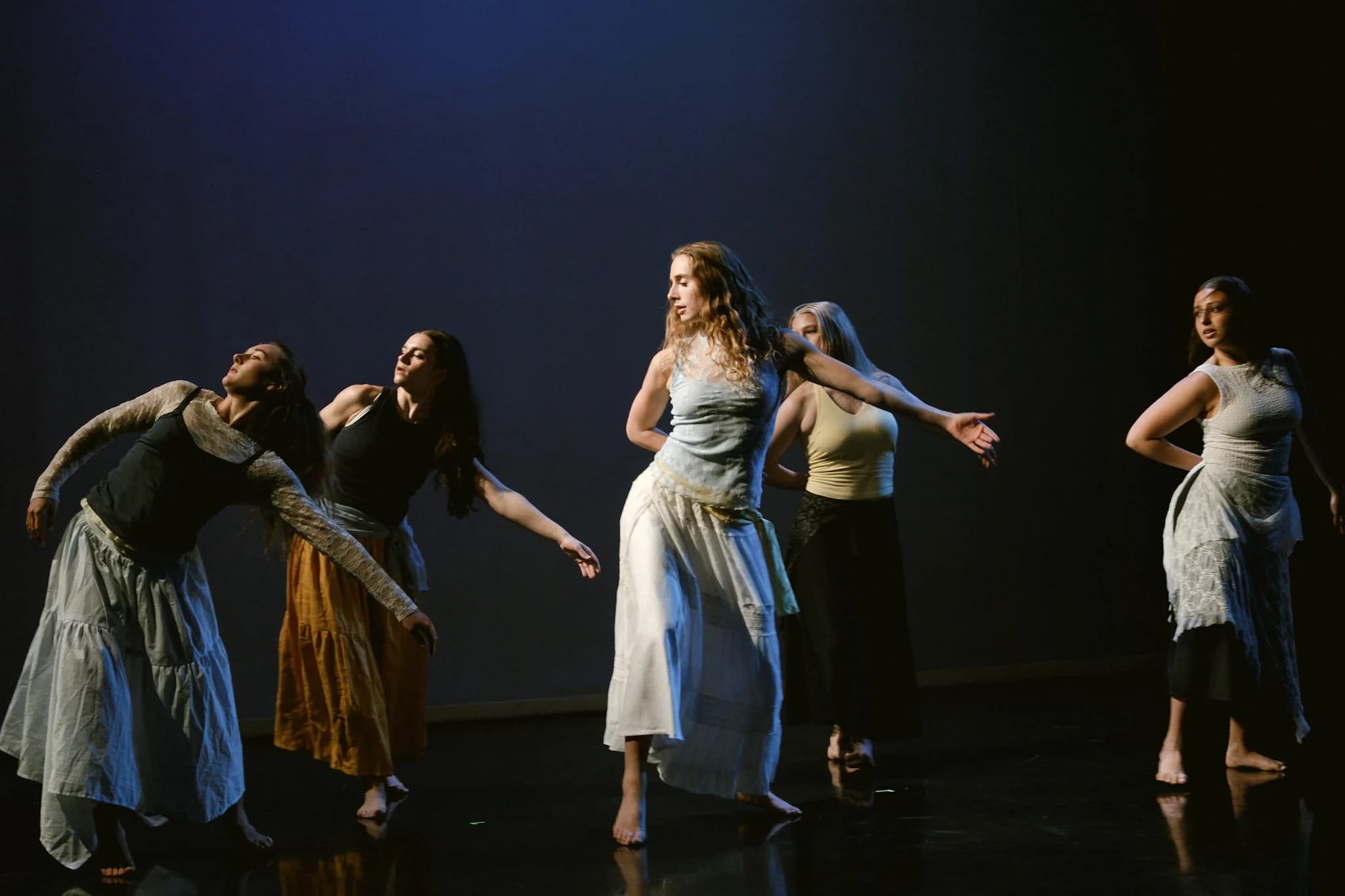Eleven Stars dancer in a grounded stage phrase